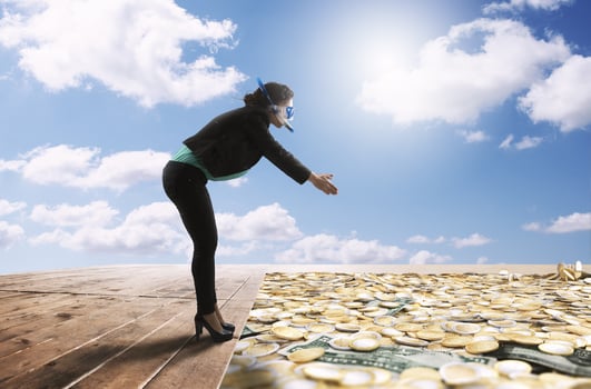Businesswoman is ready to dip in a big swimming pool full of coin and money photo