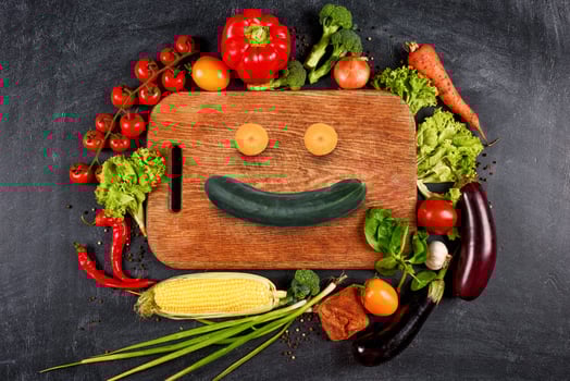 Healthy background of vegetable with a shape of smile. Concept of genuine food photo