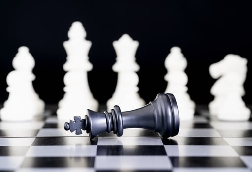 Closeup chess pieces on chessboard photo