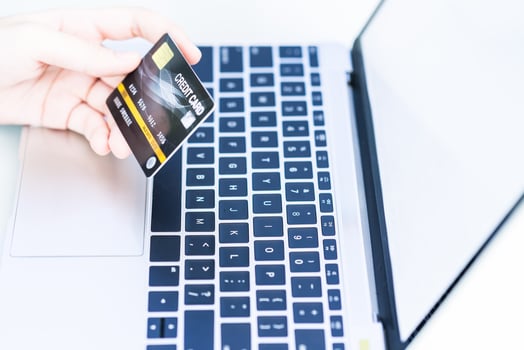Woman hands holding a credit card for online shopping photo