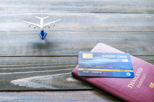 Passport with  credit card on brown wooden photo