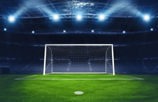 Soccer goalpost under spotlights in the stadium. 3D Rendering photo