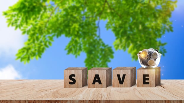 Wooden blocks with words save money Coins for investment loan planned future concept. saving, charity, family finance plan concept, fundraising, superannuation, financial crisis concept photo