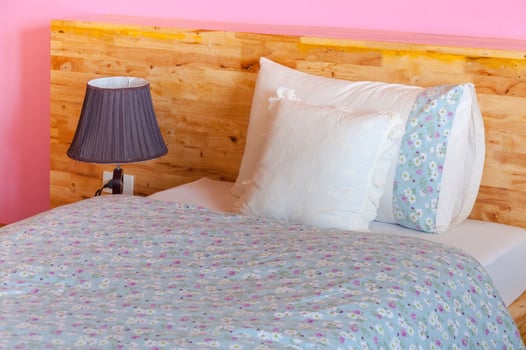 Interior style in bedroom, modern wood bed,Pillow on bed decoration in beautiful bedroom interior photo