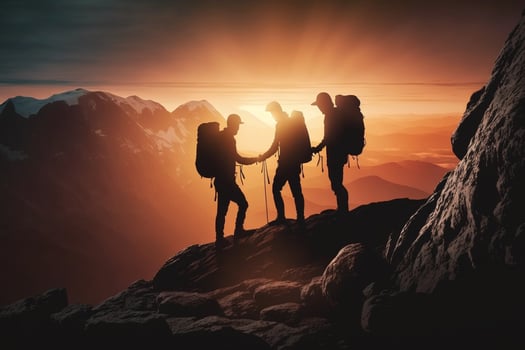 People helping each other hike up a mountain at sunrise. Giving a helping hand, and active fit lifestyle concept, dark theme sunset AI Generated photo