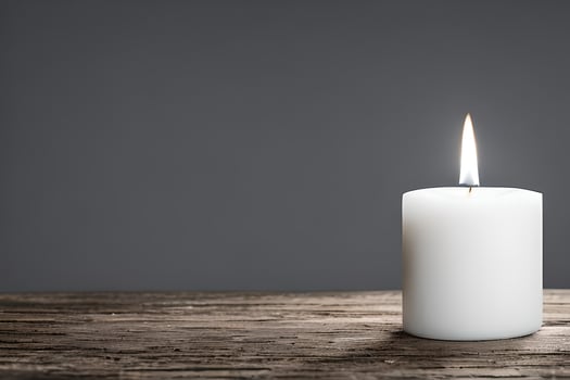 A captivating close up of a white candle capture the essence of relaxation, peace, elegance and grace for wedding, invitations, spiritual or religious project, including home decor, or any occasion. photo