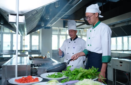 Young chef, University professor is passing on the knowledge of cooking to students photo