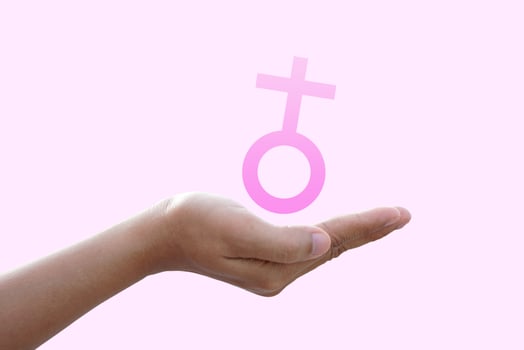 concept of protecting women female symbol on human hand photo
