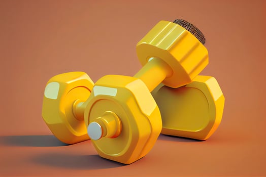 Two dumbbells on isolated yellow background. Fitness accessories photo