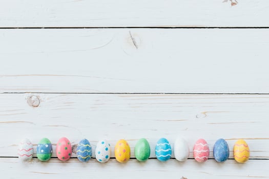 Colorful eggs easter on white wood background with space for text. photo