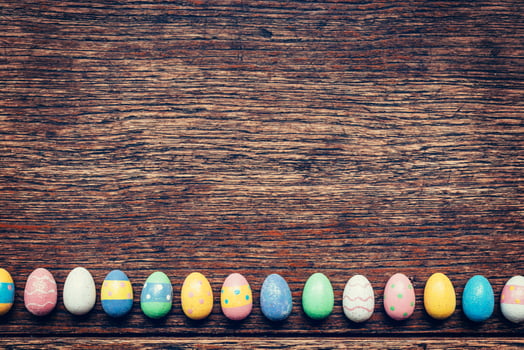 Colorful easter egg on wood background with space. Vintage toned. photo