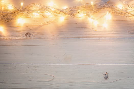 christmas background and lights garland on wood background with space. photo