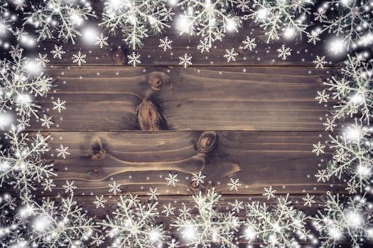 Wooden brown christmas background and snow white with snowflakes, copy space. photo