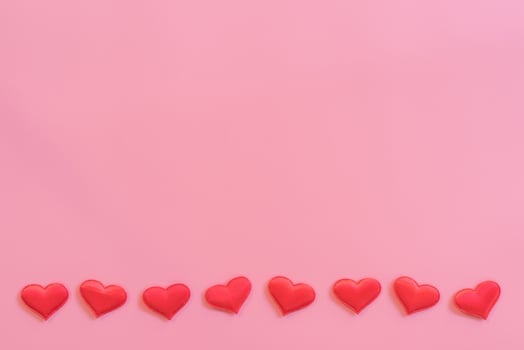 Red heart on pink pastel color background with space for text. photo