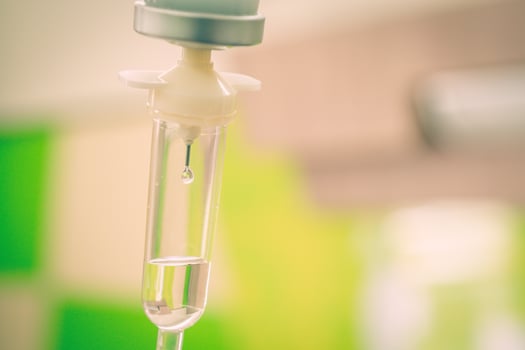 Saline solution drip for treatment patient in the hospital. photo