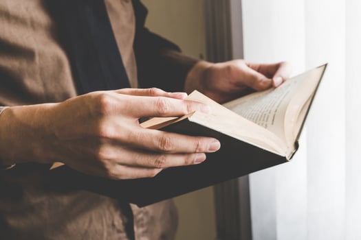 Businessman holding book at window. Creative Business Startup Idea. photo