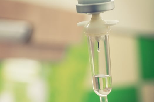 Saline solution drip for treatment patient in the hospital. photo