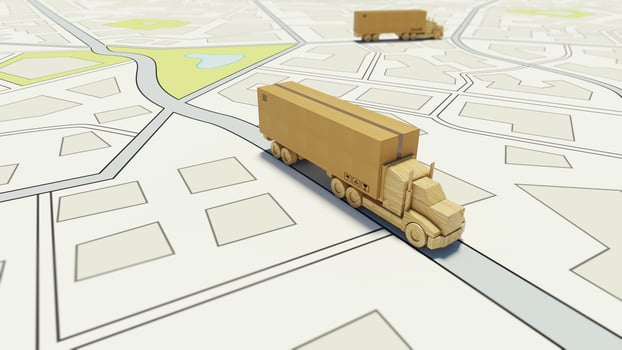 Big cardboard box package on a wooden toy truck ready to be delivered on a road map photo