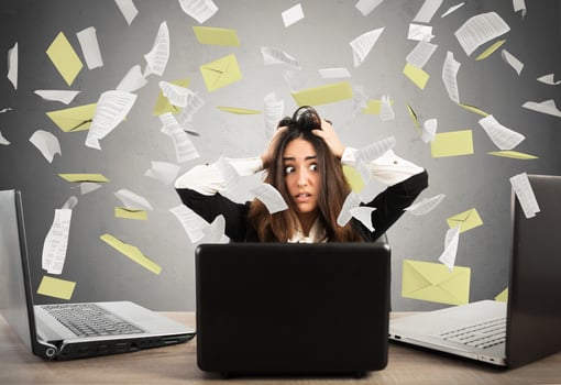 Businesswoman stressed by spam photo