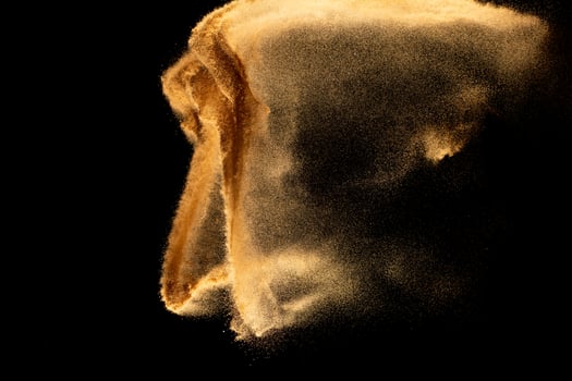 Dry river sand explosion.Brown color sand splash against black background. photo