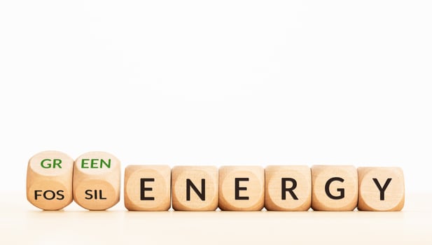 Change from fossil energy to green energy concept. Text on wooden blocks. Copy space photo