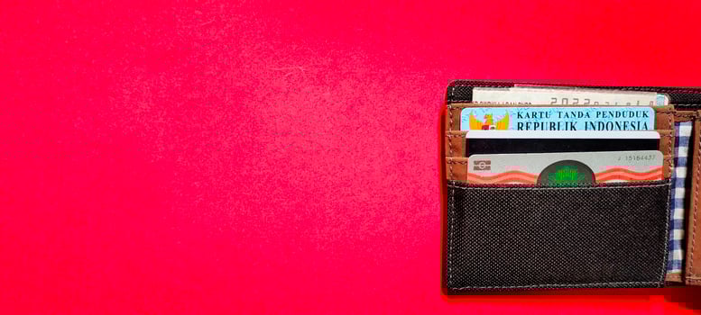 Negative space from a wallet containing identity cards, driving licenses and motor vehicle certificates. photo