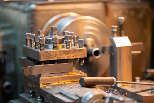 Part of an industrial lathe in a metallurgical plant. photo