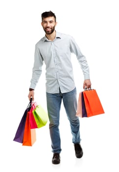 Handsome man holding shopping bags photo