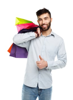 Handsome man holding shopping bags photo