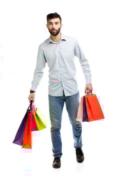 Man holding shopping bags. Christmas and holidays concept photo