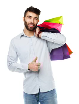 Handsome man holding shopping bags photo