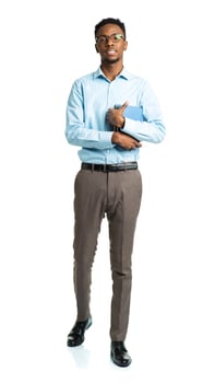 Happy african american college student standing with books in his hands on white photo