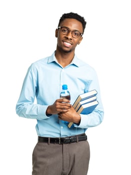 Happy african american college student with books and bottle of water in his hands  standing on white photo