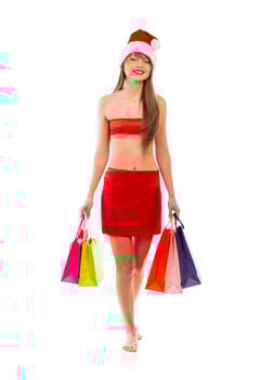 Beautiful Santa christmas girl with shopping bags on white photo