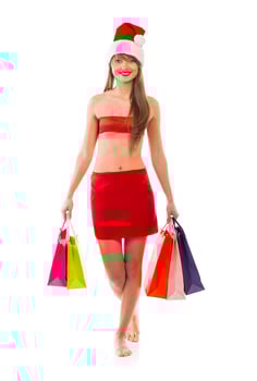 Beautiful Santa christmas girl with shopping bags on white photo
