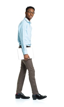 African american college student with laptop standing on white photo