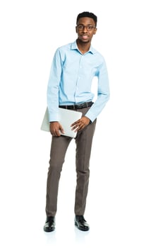 Happy african american college student with laptop standing on white photo
