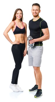 Athletic man and woman with dumbbells on the white photo