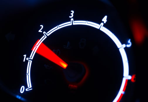 Tachometer illuminated at night photo
