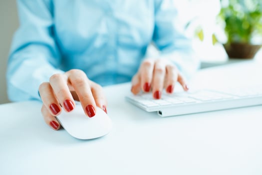 Woman office worker typing on the keyboard photo