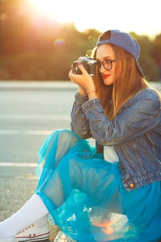 Hipster girl with old camera photo