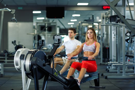 Man and woman working out at the gym photo