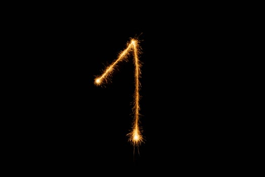 Number made with sparklers ready for your inscriptions on black background photo
