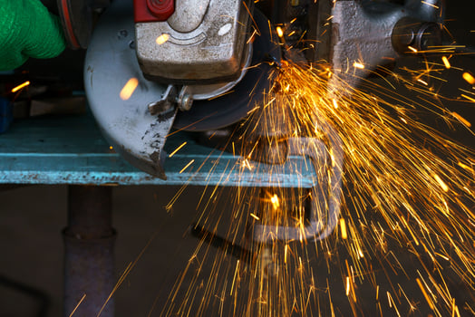 Angular grinding machine is cutting the metal photo