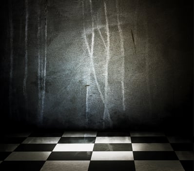 Stone interior with checkered marble floor photo