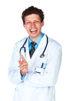 Portrait of a smiling male doctor showing finger at you on white photo