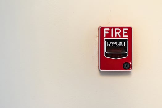 Fire alarm switch on white wall background photo