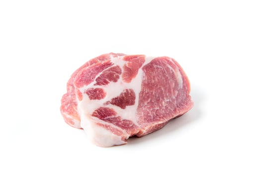 Pieces of pork meat, isolated on white, raw fresh pork neck meat steaks photo