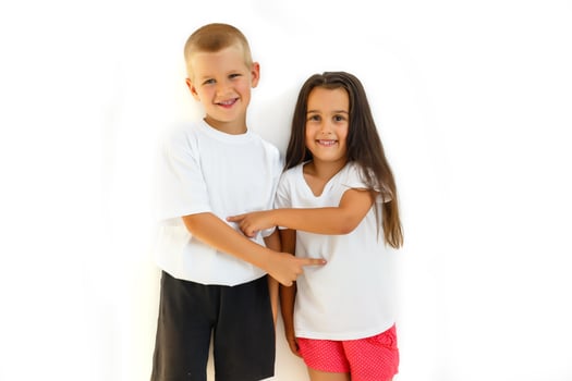 Teens brother and sister. The concept of a happy childhood, beauty, people, fashion, healthy lifestyle. Isolated on white background. photo
