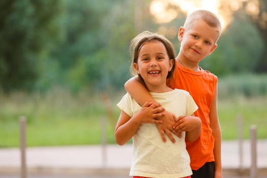Portrait Of Children With Friends On Hiking Adventure In Woods photo